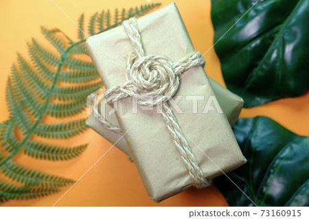 Handmade crafted paper gift boxes on wooden table . Handmade crafted paper gift boxes on wooden table . 73160915