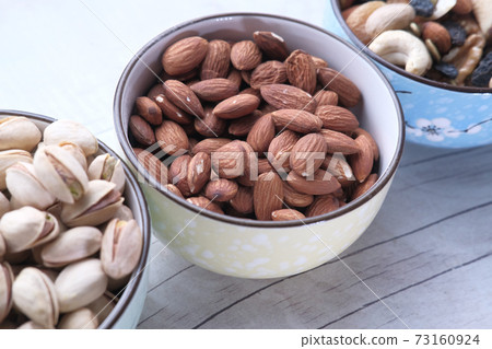 Close up of almond nut isolated on white Close up of almond nut isolated on white 73160924