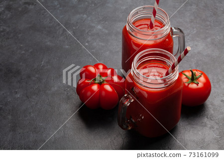 Fresh tomato juice and ripe tomatoes 73161099