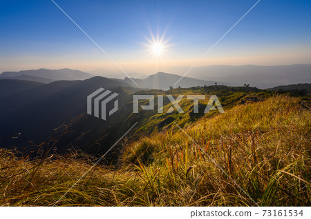 Beautiful mountain landscape at sunsest at Phu Chi fa Beautiful mountain landscape at sunsest at Phu Chi fa 73161534