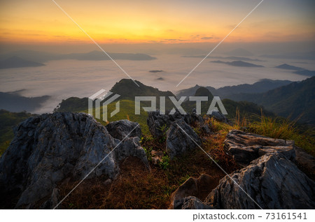 Beautiful misty mountain landscape view in morning at Doi Pha mon peak viewpoint Beautiful misty mountain landscape view in morning at Doi Pha mon peak viewpoint 73161541