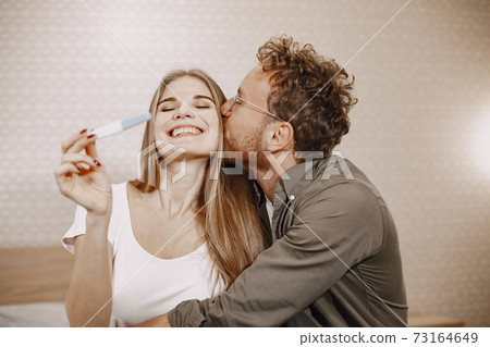 Couple finding out results of a pregnancy test Couple finding out results of a pregnancy test 73164649