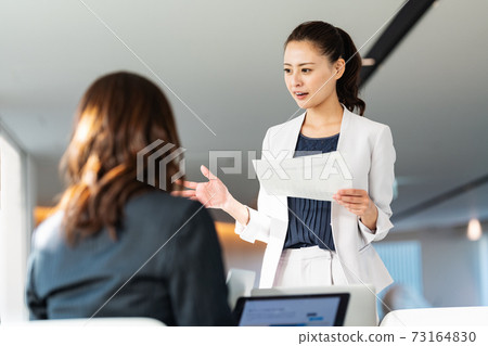 Career woman talking at a meeting shooting cooperation "LINK FOREST" Career woman talking at a meeting shooting cooperation "LINK FOREST" 73164830