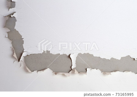 White color paint peeling off on ceiling house. Under the roof 73165995