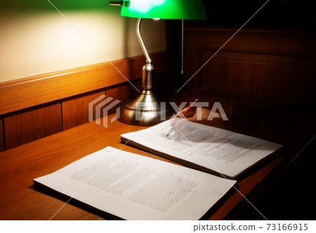 blurred proofreading paper on wooden table blurred proofreading paper on wooden table 73166915