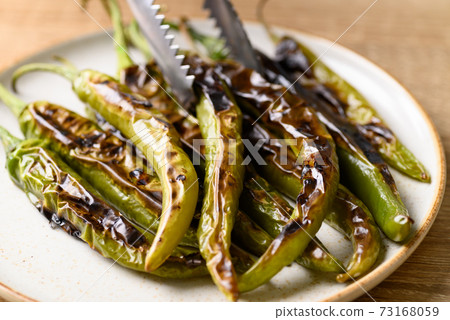 Grilled green chili pepper, ingredient of Northern Thai food 73168059