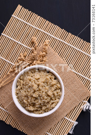 Cooked brown quinoa seeds in a bowl, Healthy vegan food Cooked brown quinoa seeds in a bowl, Healthy vegan food 73168141
