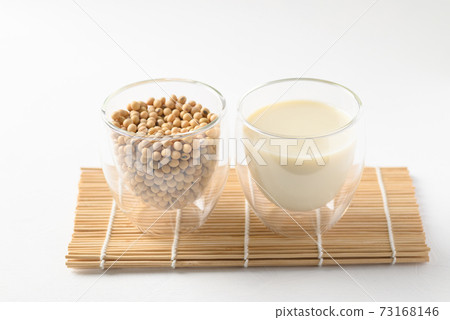 Soybeans seed and soy milk in a glass, Healthy drink Soybeans seed and soy milk in a glass, Healthy drink 73168146