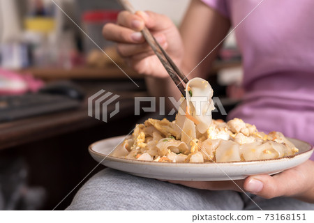 Asian woman have lunch (Thai food) at home during working Asian woman have lunch (Thai food) at home during working 73168151