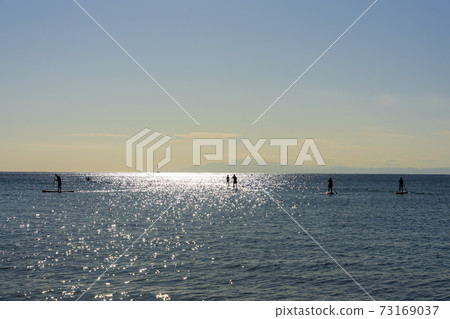 People who enjoy stand up paddle board 73169037
