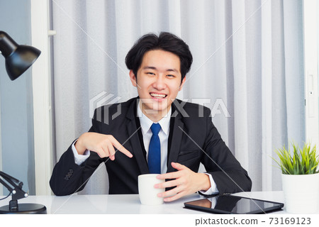 Businessman video conference call using smart digital tablet computer on desk Businessman video conference call using smart digital tablet computer on desk 73169123