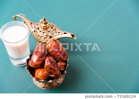 Ramadan, Dates in golden bowl, Milk, arabian Aladdin golden lamp vintage style 73169124