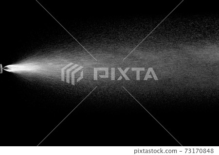 Water spray effect. Spraying mist of air gun or atomizer for cosmetic concept isolated on black background. 73170848