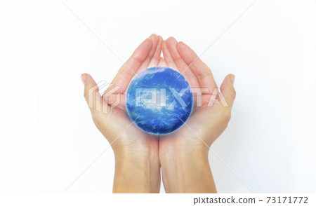 Female hands gently surrounding the earth on a white background 73171772