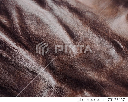 Crumpled brown cowhide background image 73172437