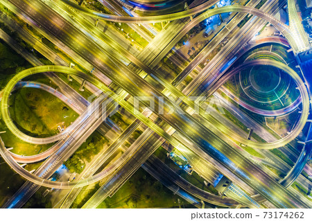 Aerial view night traffic light interchange city road Aerial view night traffic light interchange city road 73174262