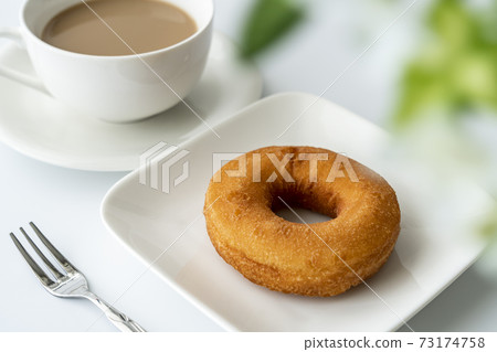 Donuts and milk tea on a white plate [white background] 73174758