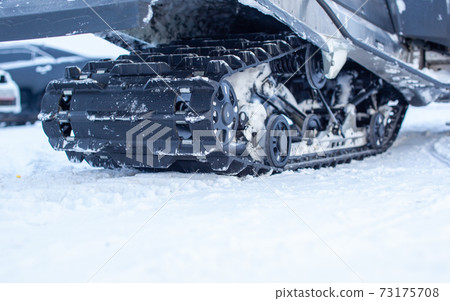 Rear suspension of a snowmobile in winter. Riding in the snow 73175708