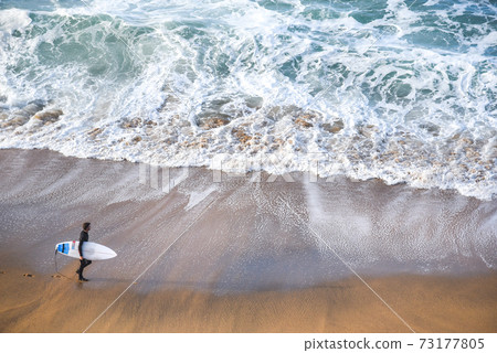 surfer man on the beach 73177805