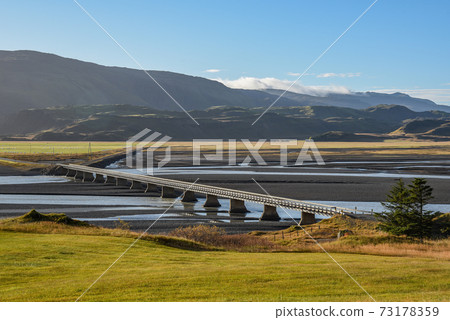 bridge cross over river, landscape in summer of Iceland bridge cross over river, landscape in summer of Iceland 73178359