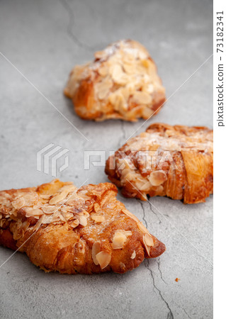 Fresh baked croissants on cement background. Fresh baked croissants on cement background. 73182341