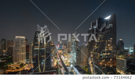 Aerial view of Ploenchit, Bangkok Downtown at night. Financial district and business centers in smart urban city in Asia. Skyscraper and high-rise buildings. Thailand 73184662