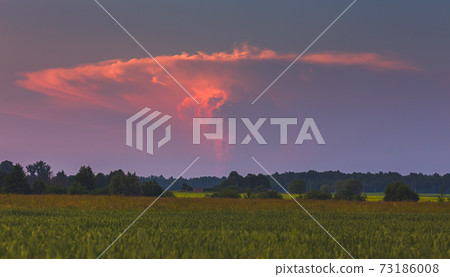 Cumulonimbus storm cloud rising in the sky, a powerfull updraft, supercell cloud 73186008