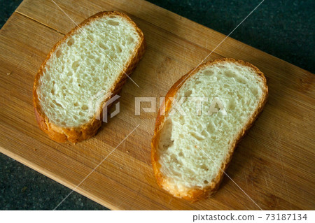 Cutted two slices of bread Cutted two slices of bread 73187134