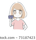 A woman with a credit card and a proud face 73187423