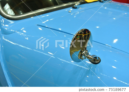 Vintage car side mirror with chrome finish.  73189677