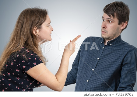 Jealousy hysterical wife is shouting and blaming her husband. Jealousy hysterical wife is shouting and blaming her husband. 73189702