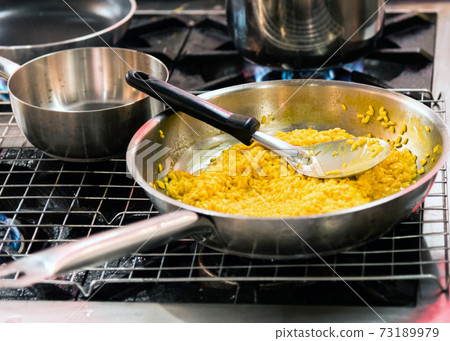 Chef cooking Risotto in the kitchen in the kitchen, Cook Risotto Chef cooking Risotto in the kitchen in the kitchen, Cook Risotto 73189979