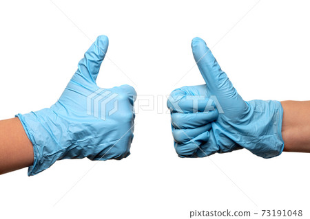 Two female doctors hands in medical gloves showing thumbs up isolated on white 73191048