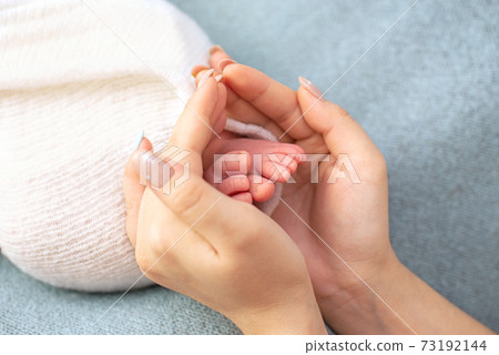 Newborn baby feet. Motherhood concept. Mother day. Copy space. Newborn baby feet. Motherhood concept. Mother day. Copy space. Selective focus Newborn baby feet. Motherhood concept. Mother day. Copy space. Newborn baby feet. Motherhood concept. Mother day. Copy space. Selective focus 73192144