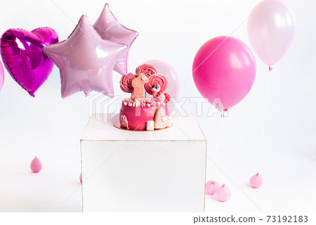 Pink cake for the birthday of a girl of one year. Balloons. unicorn. 73192183