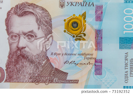 Ukrainian currency. Macro shot of one thousand hryvnia banknote Ukrainian currency. Macro shot of one thousand hryvnia banknote 73192352