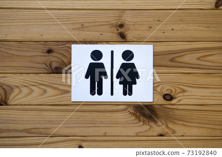 Toilet Sign on wooden wall background. Ecotoilet Toilet Sign on wooden wall background. Ecotoilet 73192840