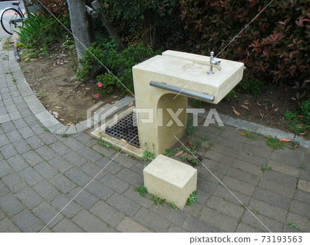 Drinking fountain in the children's park 73193563