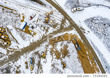Aerial drone view on winter road construction in Polish Beskidy 73194265