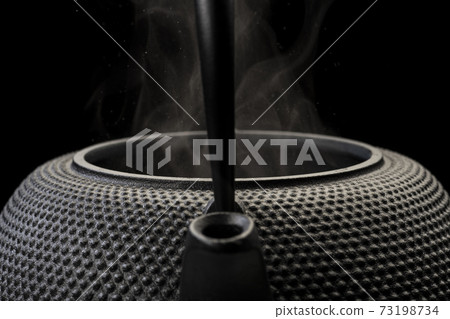 Boil water in an iron kettle Boil water in an iron kettle 73198734