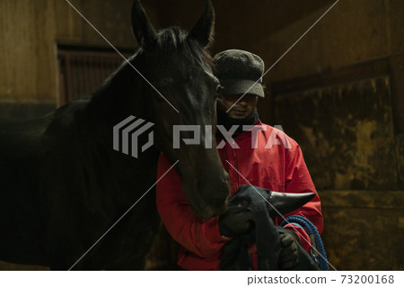 Racehorses and keeper Racehorses and keeper 73200168