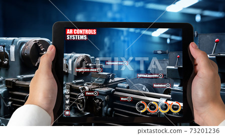 Engineer use augmented reality software in smart factory production line 73201236
