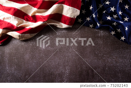 Happy Martin Luther King Day anniversary concept. American flag against dark stone background Happy Martin Luther King Day anniversary concept. American flag against dark stone background 73202143
