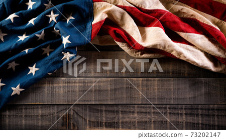 Happy presidents day concept with flag of the United States on old wooden background. Happy presidents day concept with flag of the United States on old wooden background. 73202147