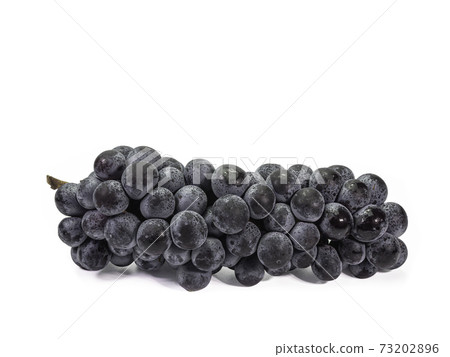 The close up of ripe organic black seedless grape bunch, healthy juicy berry fruits isolated on white background. 73202896