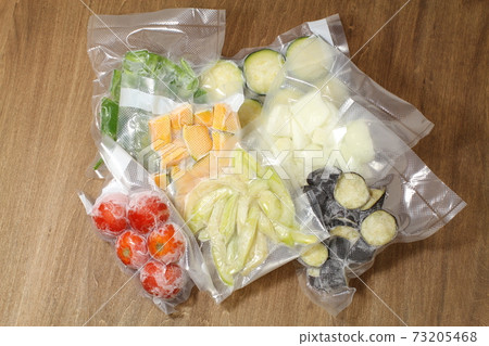 Frozen vacuum-packed summer vegetables in a freezer bag, ratatouille frozen vegetables set 73205468