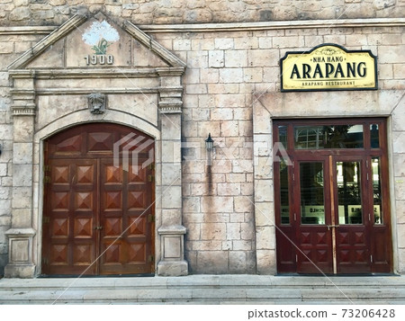 Exterior decoration wooden door and brick wall ancient of European style house (French village at Ba Na Hills, Vietnam) Exterior decoration wooden door and brick wall ancient of European style house (French village at Ba Na Hills, Vietnam) 73206428
