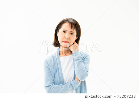 Worried senior woman Worried senior woman 73207238