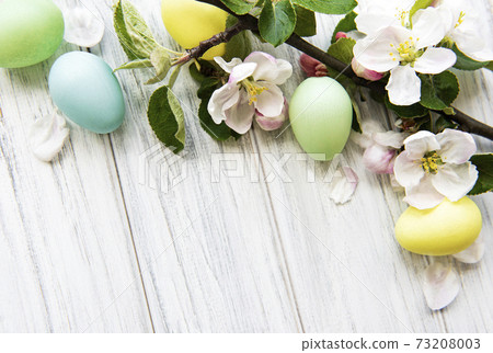 Colorful Easter eggs with spring blossom flowers 73208003