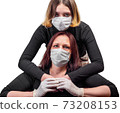 Girl and woman in medical protective mask 73208153